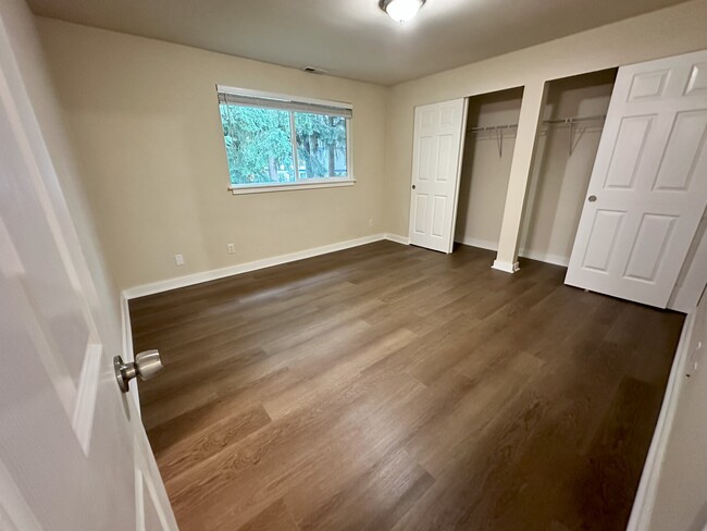 Master bedroom with four huge wardrobes and an attached bathroom. - 17731 NE 88th Pl