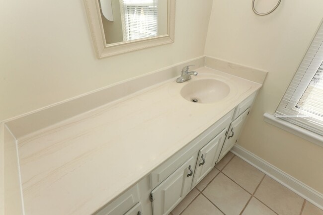 Building Photo - Spacious 4BR Home with a Fenced Yard & Jetted Tub