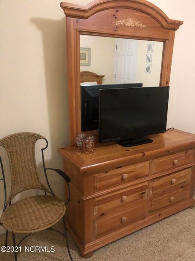 Building Photo - FULLY FURNISHED CONDO in sought-after Sea Trail subdivision!