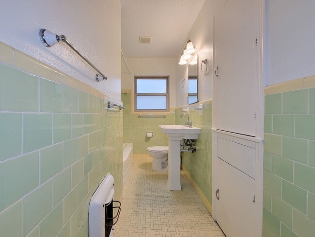 Building Photo - Step into your new home nestled in the vib...