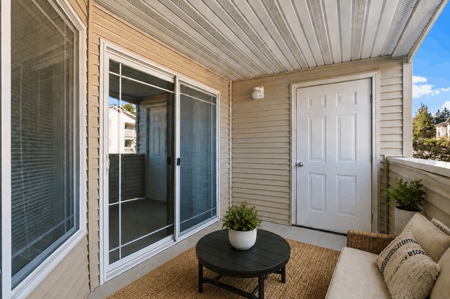 Extend your living space outdoors with a private covered patio. - Villas at Lawrence
