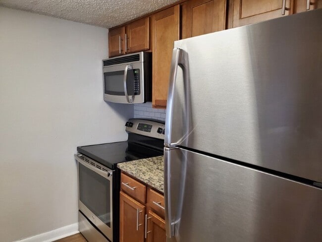 Built-in microwave and a glass top stove - 136 S Penn
