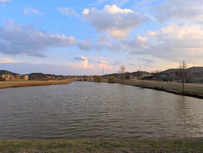 Building Photo - Modern Norman Home | Storm Shelter, Covered Patio, Community Pond & Park!