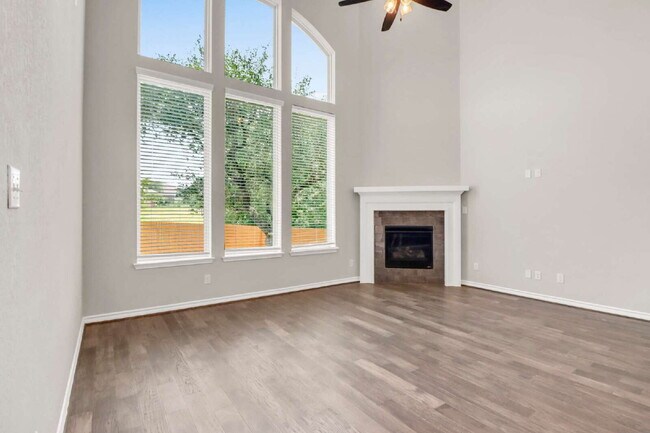 Building Photo - ASK ABOUT FREE APPLICATIONS THROUGH AUGUST!  "Spacious 4-Bedroom Sanctuary with Cozy Fireplace in...