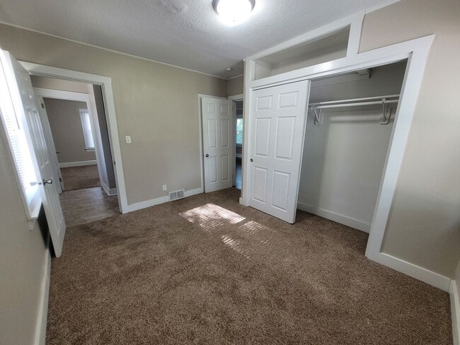 Building Photo - Two bedroom, One Bathroom Home with Partially fenced back yard