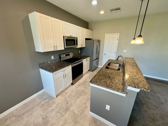 Building Photo - Move in ready 3/2 New Construction Townhou...