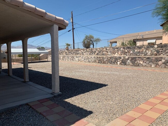 Building Photo - Spacious 3-Bedroom Home with RV Parking & 3-Car Garage in Bullhead City
