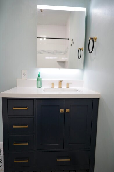Updated vanity and mirror - 413 19th Ave NE