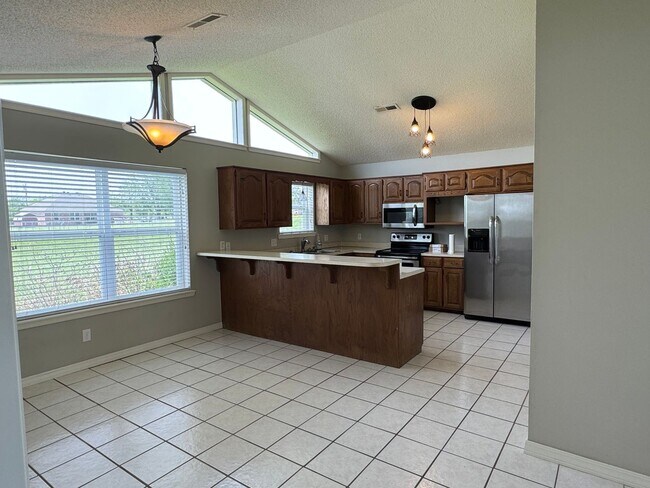 Building Photo - Available July 2025! 4-Bedroom, 2-Bathroom...