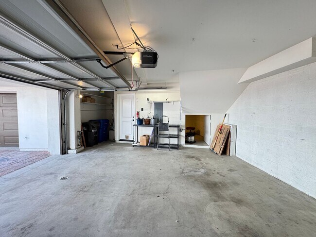 Building Photo - Beautifully Remodel Townhouse with AC & Two Car Garage!