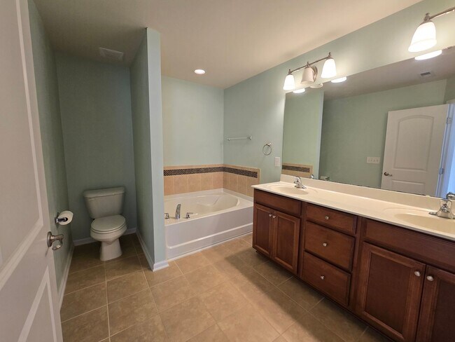 Building Photo - Classic & Comfortable West Durham Townhome with Timeless Design