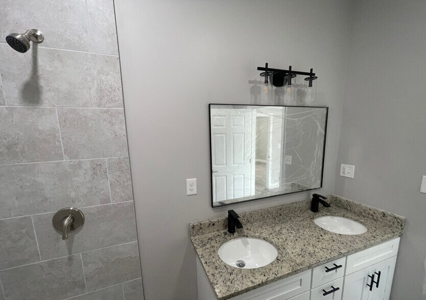 Unit two: (master bedroom) double-sink master bathroom with shower (*brand new sliding glass shower - 34 Falcon St