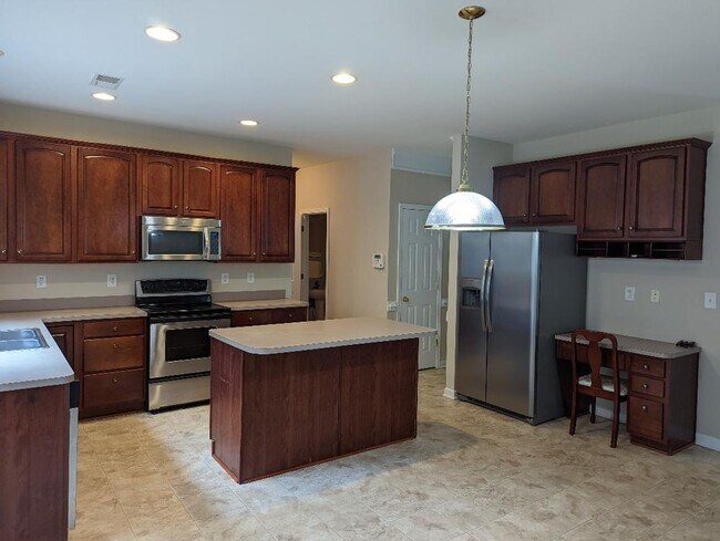 Building Photo - 4 BEDROOMS PLUS BONUS, BEAUTIFUL BACK PATI...