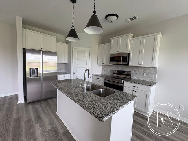 Building Photo - The perfect blend of modern living and small-town charm