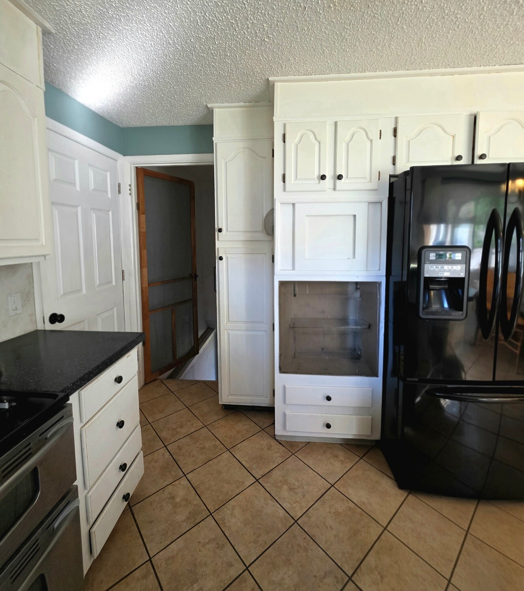 Kitchen into basement and garage - 1409 2nd West Hill Dr