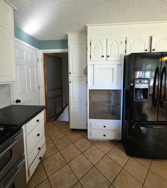 Kitchen into basement and garage - 1409 2nd West Hill Dr