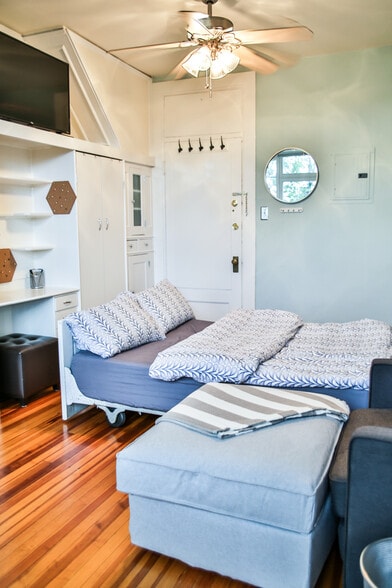 bed is like a Murphy Bed that pulls out from inside the dresser. In the morning, you just push it right back in and have the open floor plan! - 726 East 16th Avenue