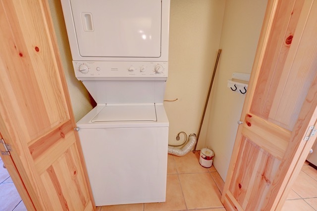 Unit 813--Washer/dryer in utility closet off of hallway - 2210 Miguel Chavez Rd