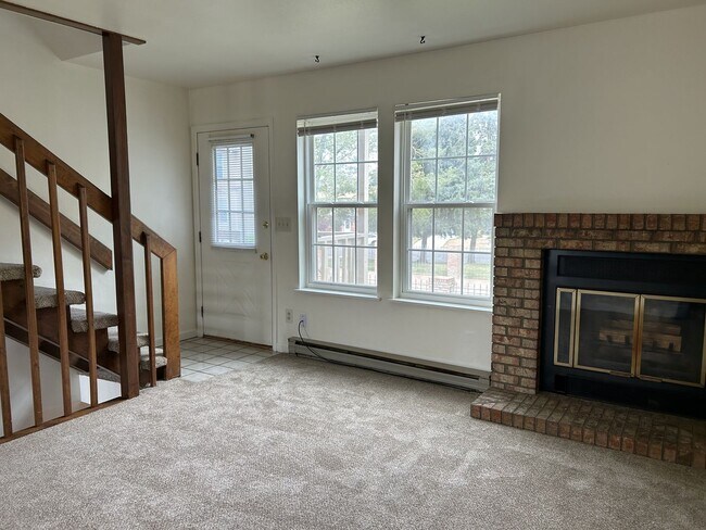 Building Photo - Quiet and Sunlit Townhome with Attached Garage and Washer/Dryer Included