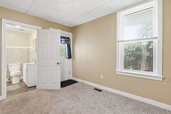Building Photo - This well-maintained 4-bedroom, 2-bath duplex offers a spacious layout with all the comforts of h...