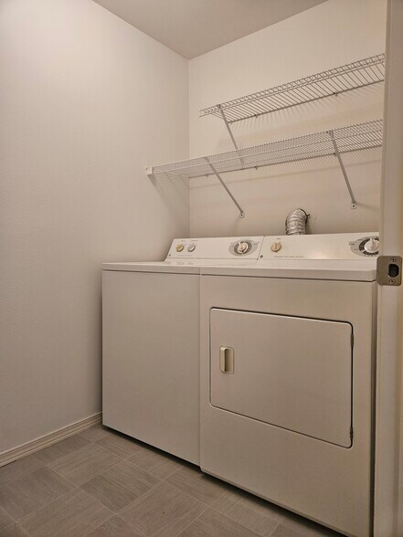 Separate laundry room with full size washer and dryer - 18621 Blueberry Ln