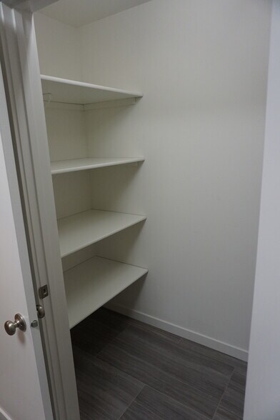 Laundry room storage space (Photos are of similar unit with similar finishes.) - 3811 Stacy Drive