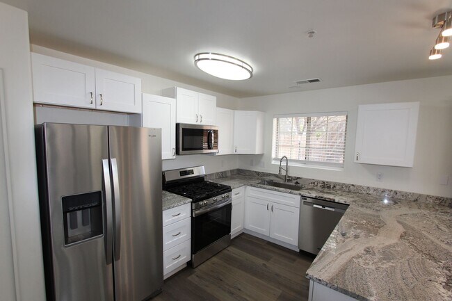 Building Photo - Remodeled End-Unit Townhome @ Village at Elk Run | 3 Bed, 2.5 Bath + 2-Car Garage