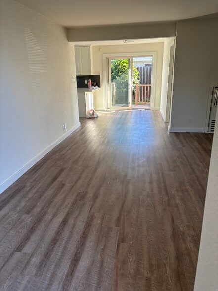 view of dining area off kitchen and sliders to back yard deck - 128 N Kingston St