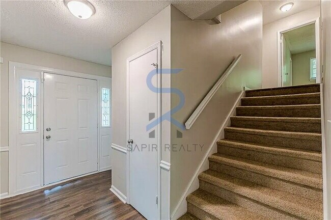 Building Photo - Move in before December 31st and choose your reward: a $250 Amazon Gift Card or a 55" Smart TV!