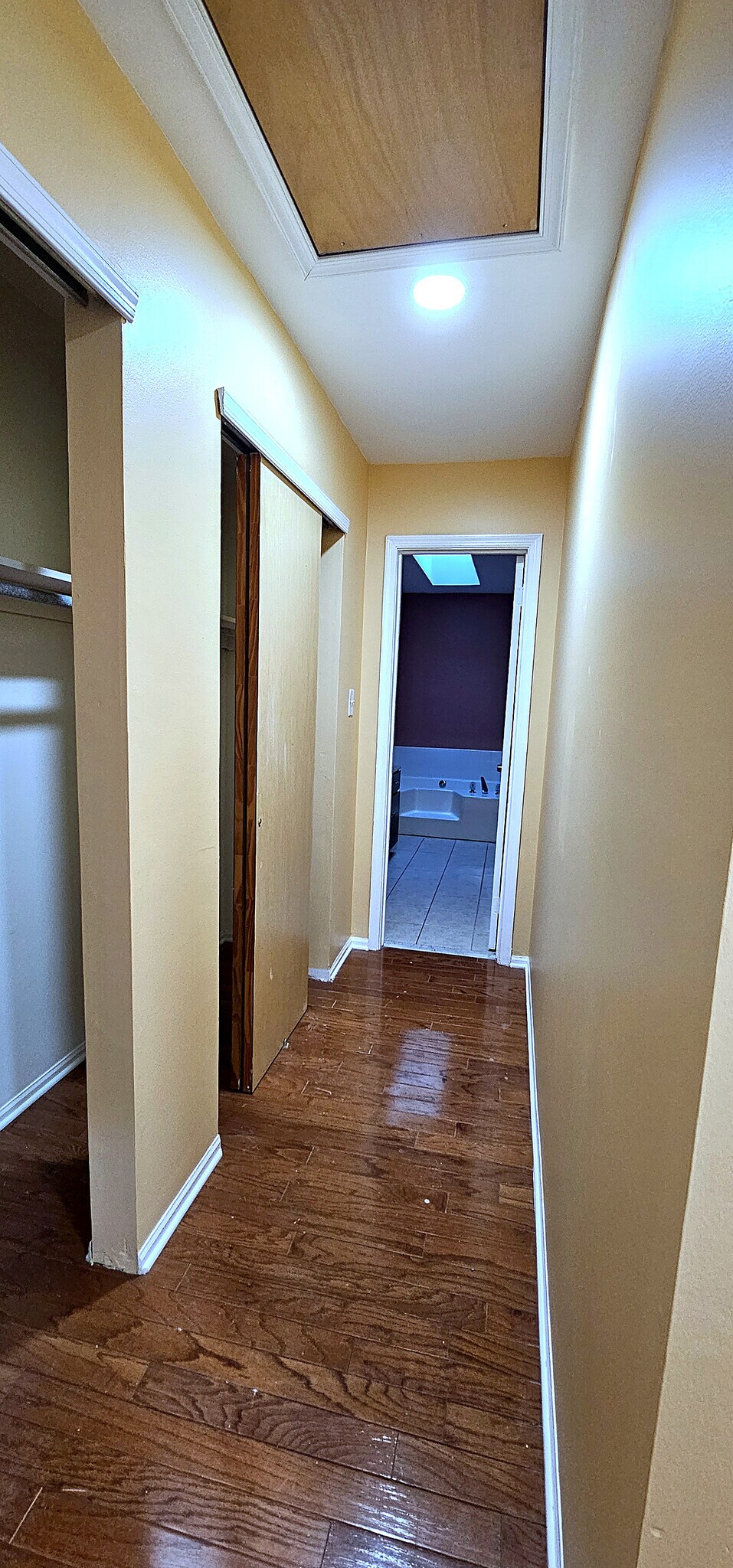 Bedroom-Level Hallway | Hardwood upper hallway with built-in linen storage and overhead attic - 43 Tynemouth Ct