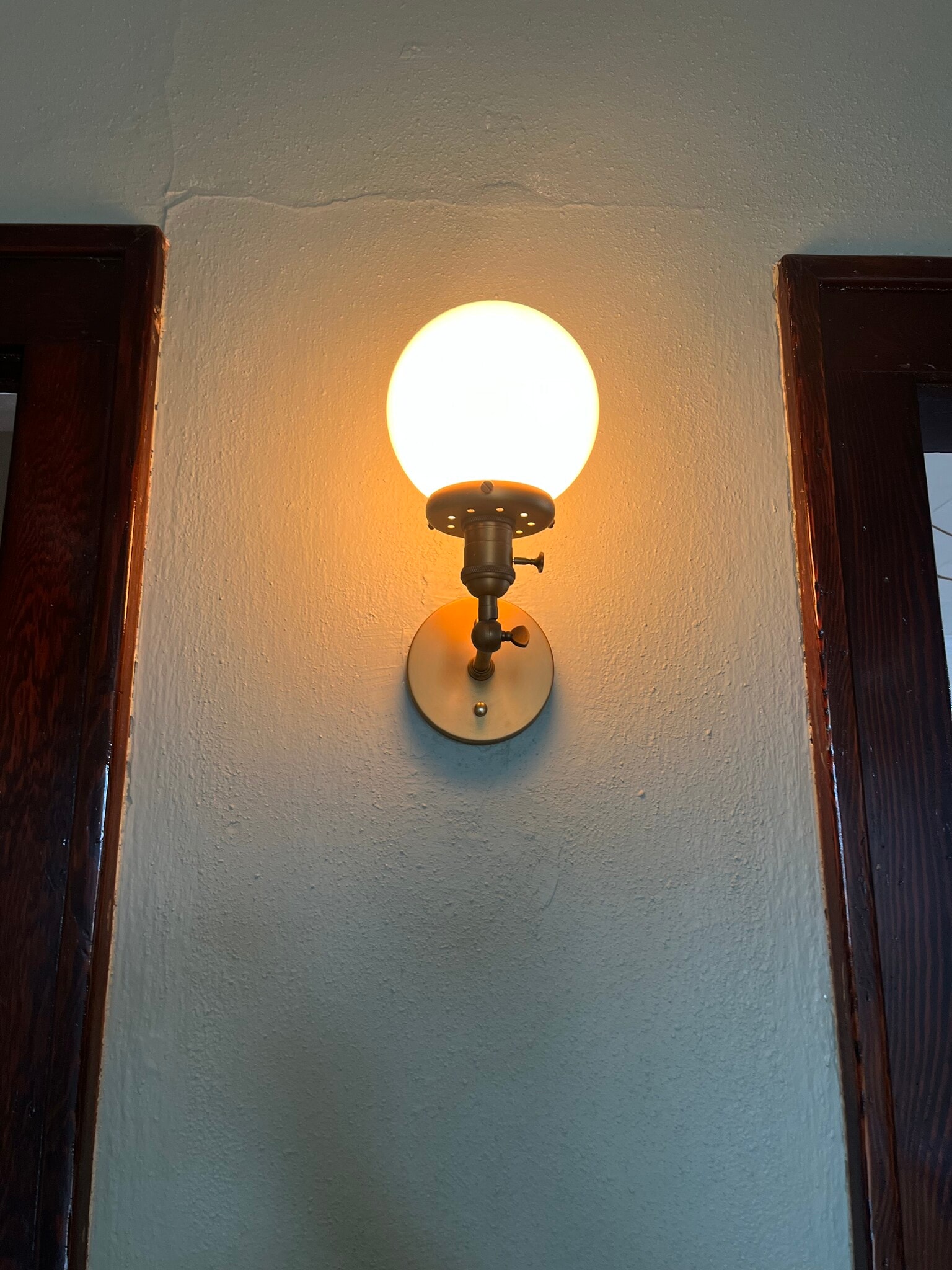 Wall sconce by front door - 415 E Saint Germain St