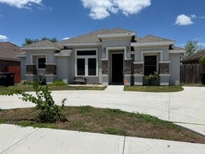 Building Photo - 1321 W Combes Ave