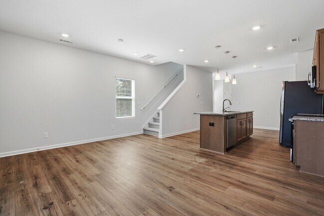 Building Photo - BRAND NEW TOWNHOME-9 FOOT CEILINGS-TWO CAR GARAGE-POOL COMMUNITY