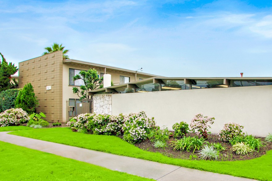 Glen haven exterior with lush landscaping - Glen Haven Apartments