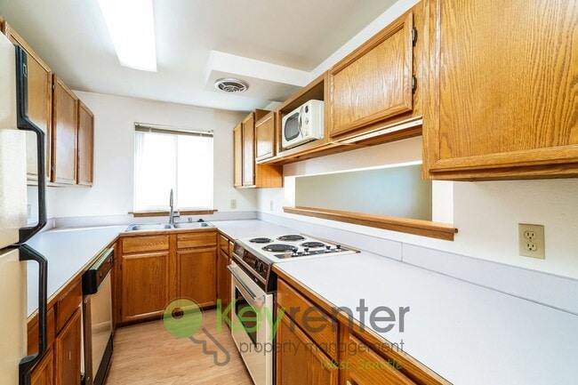 Building Photo - **Rent Special** Remodeled Two-Bedroom with Open Floor Plan, Parking, and Easy Transit Access