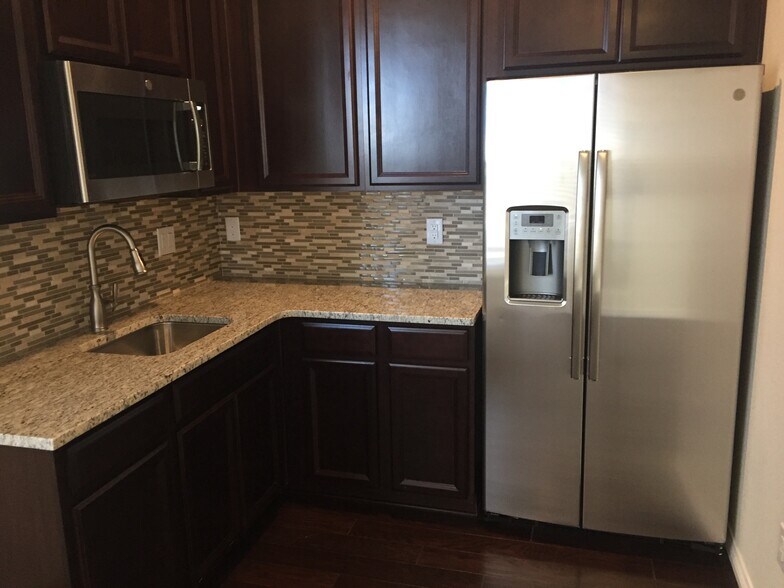 Kitchen with granite countertop - 14775 Chicago Street (Suite)