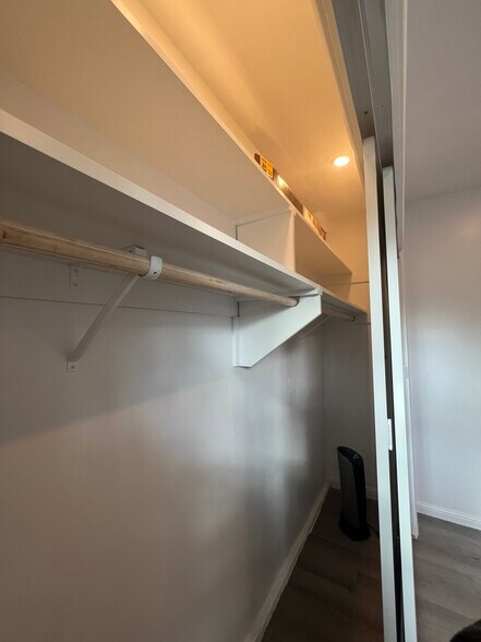 Huge sliding door closet, interior lighting with plenty of storage space. - 9300 Benson Way