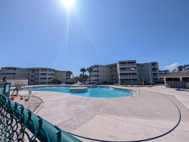 Building Photo - Dreamy Little River Condo — Furnished, Elevator Access, Pool & Marina Nearby!