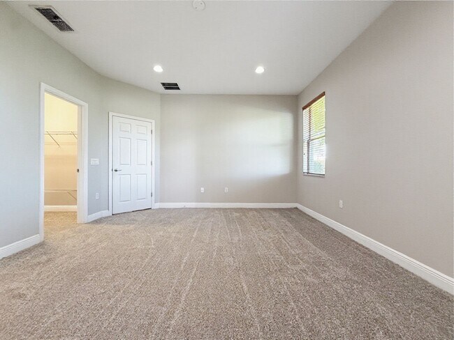 Building Photo - Waterfront 4 Bedroom Home in Eagle Creek Golf Community – Lake Nona