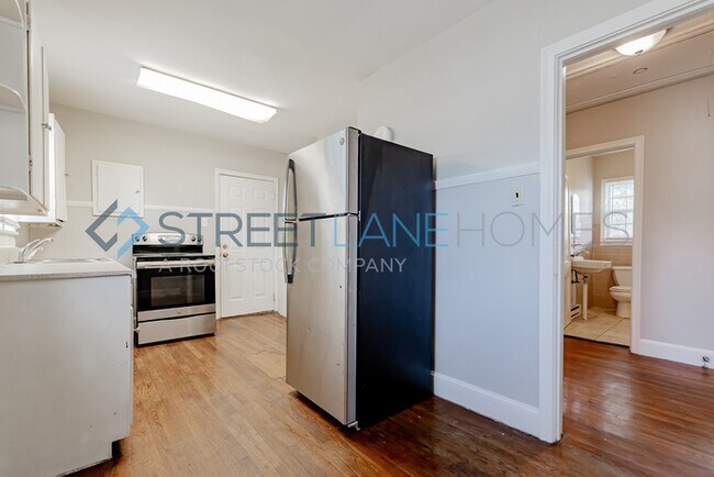 Building Photo - REDUCED! - NOW OFFERING HALF OFF FIRST FUL...