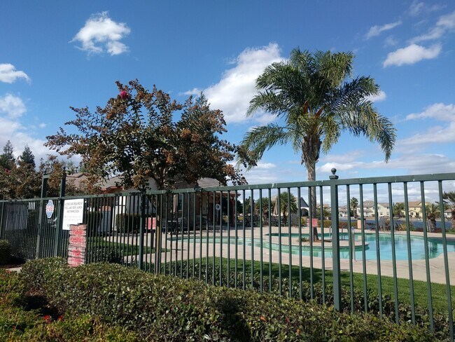 Building Photo - Gated Community Stunner ready to be called...
