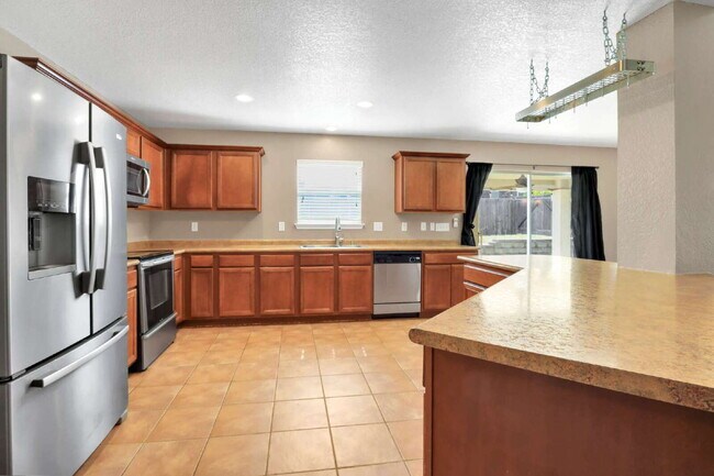 Building Photo - "Spacious 4-Bedroom Sanctuary with 3 Full ...