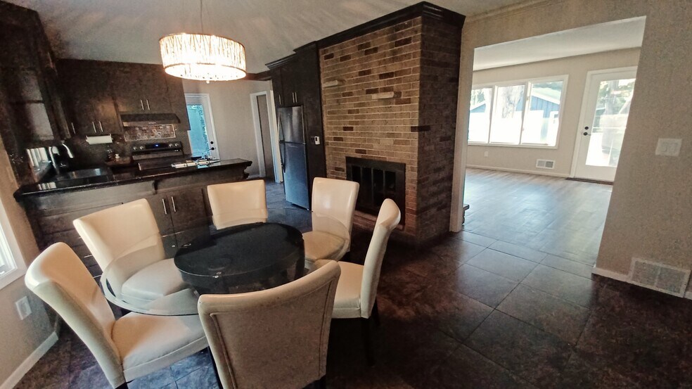 dining room, kitchen and living room - 907 County Road B W