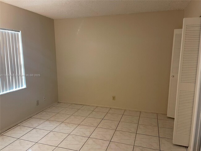 Building Photo - 10818 Royal Palm Blvd