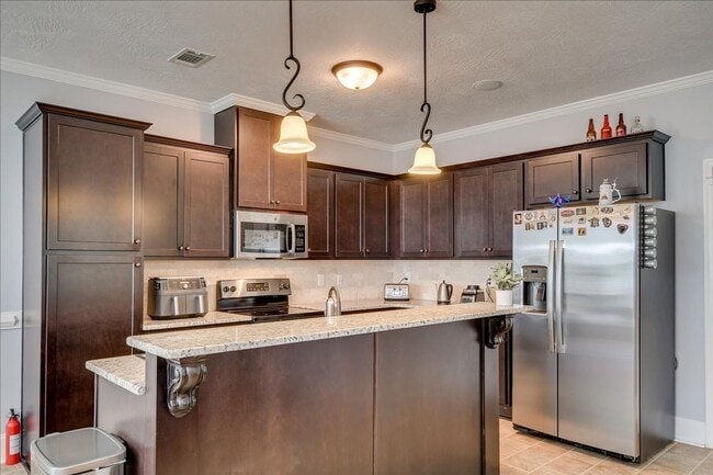 Building Photo - 4 bed, 2.5 bath home on corner lot with 2 car garage and fenced in back yard