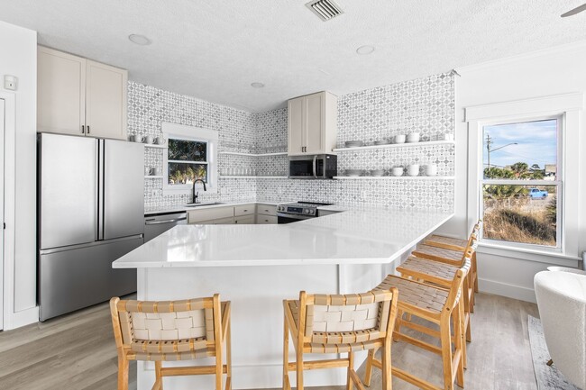 Building Photo - Newly Renovated Beach Front Four Bedroom Home