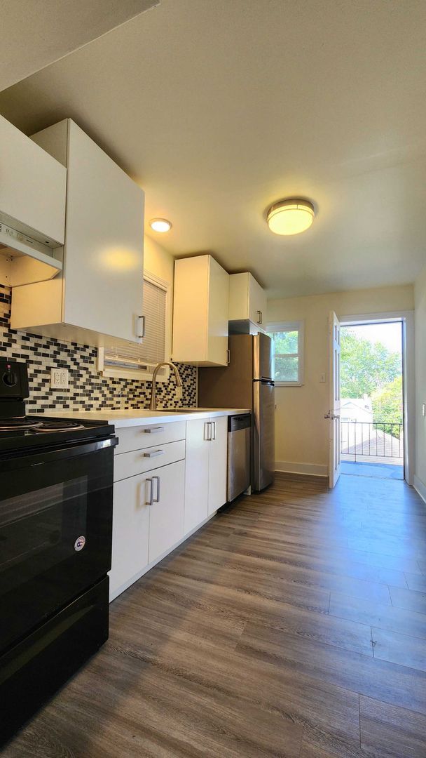 Building Photo - Updated 4BR house with garage!