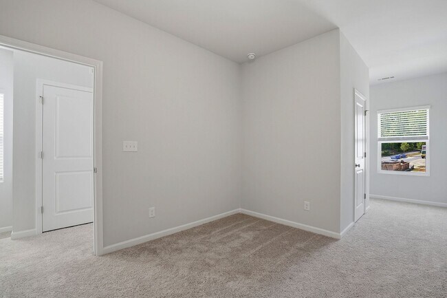 Building Photo - BRAND NEW TOWNHOME-9 FOOT CEILINGS-TWO CAR GARAGE-POOL COMMUNITY