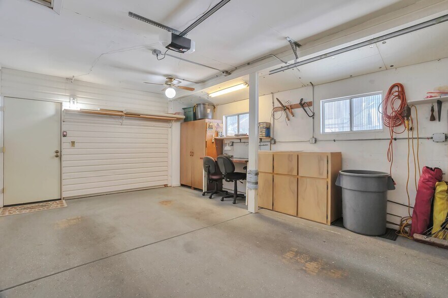 Extended 1-car garage with workbench and storage - 10113 W Pebble Beach Dr