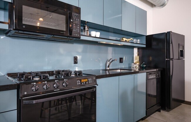 Building Photo - Rare Availability in the Streetcar Lofts, Parking, and Some Utilities Included